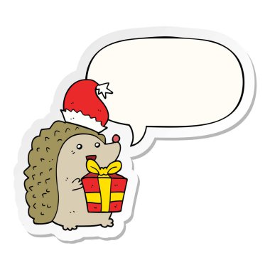 karikatür kirpi noel şapka ve konuşma kabarcık etiket giyiyor