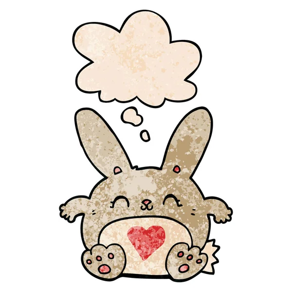 Cute cartoon rabbit with love heart and thought bubble in grunge — Stock Vector