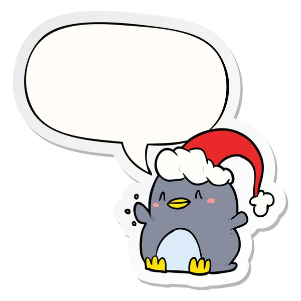 Пингвин в рождественской шляпе и наклейке с речевым пузырём — стоковый вектор