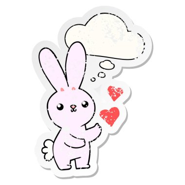 aşk kalpleri ve bir dis olarak düşünce balonu ile sevimli karikatür tavşan