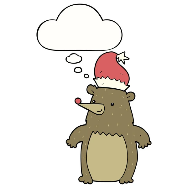 Ours de dessin animé portant un chapeau de Noël et bulle de pensée — Image vectorielle