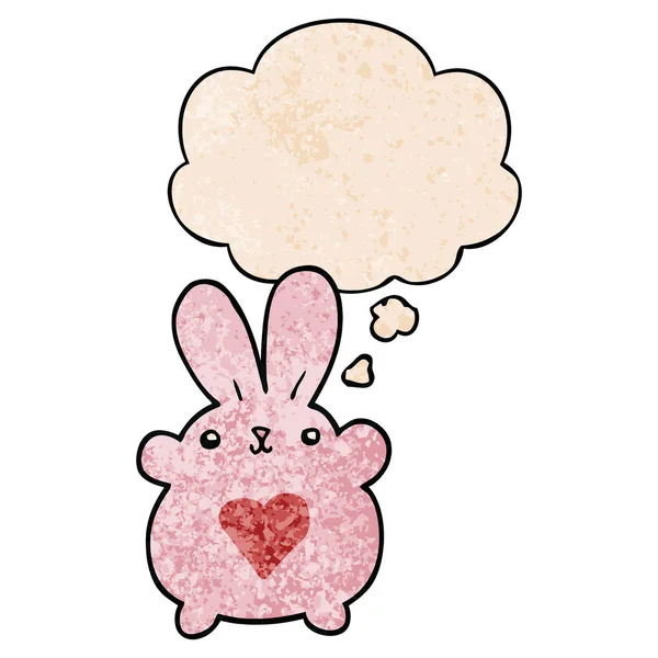Söt tecknad kanin med kärlek hjärta och tänkte bubbla i grunge — Stock vektor