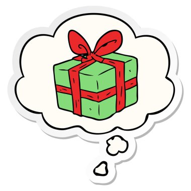 karikatür sarılmış hediye ve baskılı bir etiket olarak kabarcık düşünce