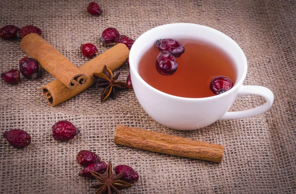 Cinnamon Sticks Anise Stars Dried Rosehip Tea White Cup Burlap — Stock Photo, Image