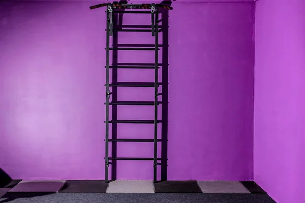 empty hall dance hall with clock on the wall and ballet bench fo