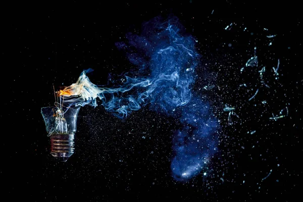 Cosmic Explosion Burning Light Bulb Flying Splinters Broken Glass Smoke — Stock Photo, Image