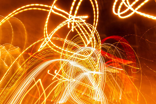 creative photography with unusual pattern of dancing light or neon in chaotic multi colored lines on abstract background. concept of unique desktop wallpaper or screensaver. copy space, texture, blur