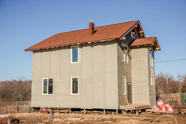 wooden interior frame of a new house under building, architectural residential construction stick built home framework.