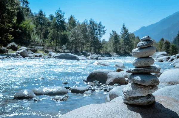 Heap of white stone stack of rock decoration in vertical style composition, copy space. Harmony, stability, strength, well being, concept. Useful in health, spa-therapy, alternative, medicine industry