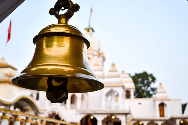 Ring bells in temple. Golden metal bell isolated. Big brass Buddhist bell of Japanese temple. Ringing bell in temple is belief auspicious. Bangkok, Thailand