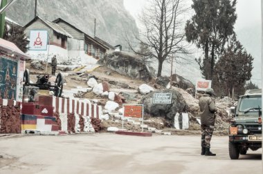 Nathu La, Sikkim, Jan 2019: An Indian BSF army major watches Indian post at a 14,500 Ft high mountain pass on 
