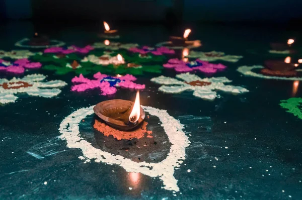 Happy Diwali. Diya Oil Lamps in DIPAWALI celebration decorated over Handmade Rangoli. — Stock Photo, Image