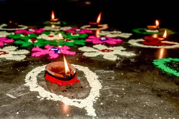 Happy Diwali. Diya Oil Lamps in DIPAWALI celebration decorated over Handmade Rangoli. — Stock Photo, Image