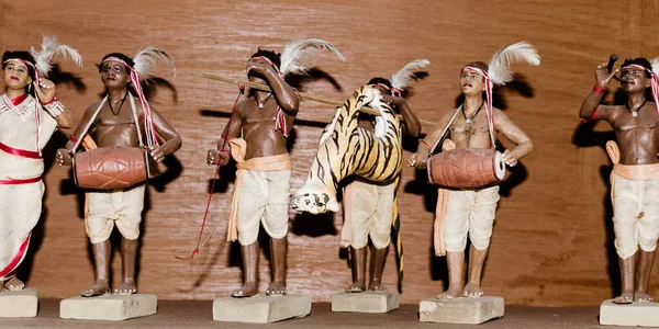 Art and craft product depicting Royal Bengal Tiger Hunting festival by tribal village people of ancient Santals tribe india. A culture of Assam Bihar Jharkhand Mizoram Odisha Tripura and West Bengal.