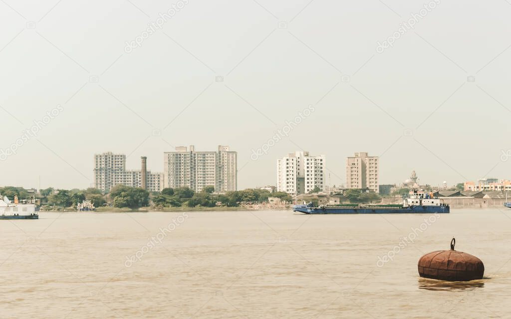 Landscape view of Kolkata (Bengali Kalikata) city capital West Bengal, on east bank Hooghly River (main channel Ganges / Ganga) Bay of Bengal. Calcutta is a city of land, river, water and sea. A domin