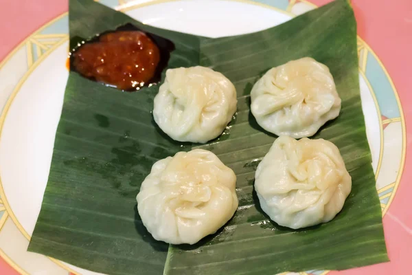 Kadubu or Steamed sweet momo one of the healthy and traditional recipe favorite of God Lord Ganesha served with Sweet Chili Sauce — Stock Photo, Image