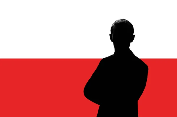 Silhouette di uomo d'affari sullo sfondo della bandiera polacca . — Foto Stock