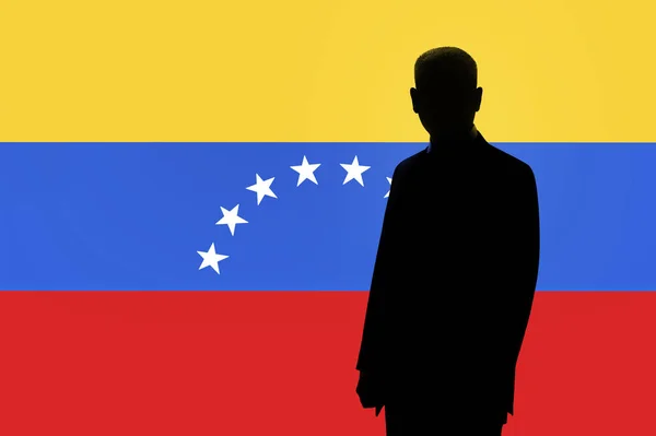 Silhouette des Geschäftsmannes auf dem Hintergrund der venezuela Flagge. Silhouette eines Mannes, mit Platz für Text. — Stockfoto
