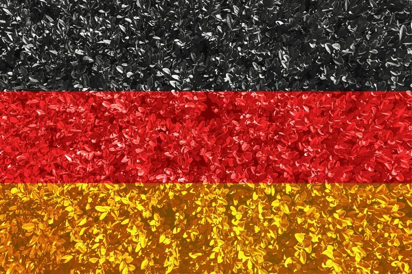 Tyska flaggan med textur av löv och buskar. Bakgrundsbild för installation och design. Utrymme för text. — Stockfoto
