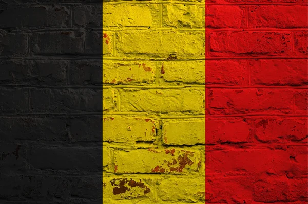 Belgium flag on brick wall background. — Stock Photo, Image