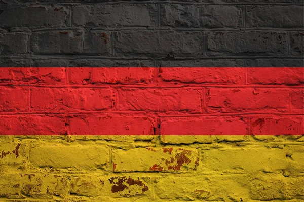 Bandera alemana sobre fondo de pared de ladrillo . — Foto de Stock