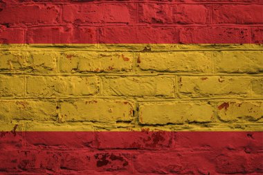 Tuğla duvar zemin üzerine İspanyol bayrağı.