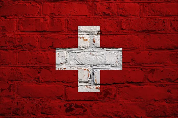 Zwitserse vlag op bakstenen muur achtergrond. — Stockfoto