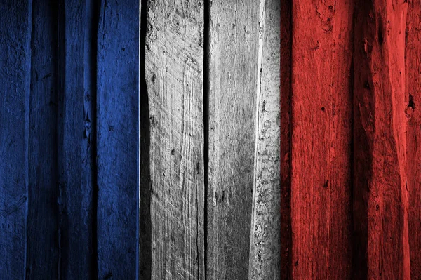 Flaga francuski na tle starych drewnianych desek. — Zdjęcie stockowe