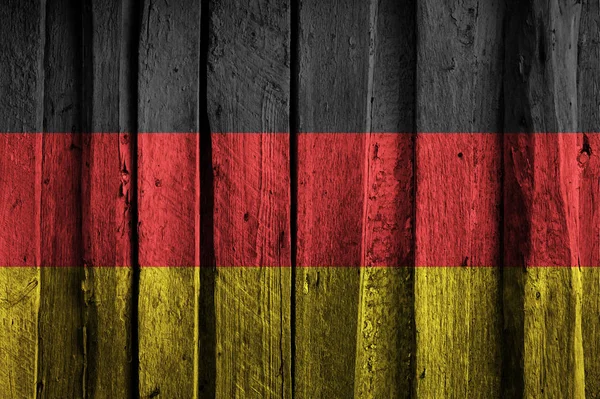 오래 된 나무 판자의 배경에 독일 깃발. — 스톡 사진