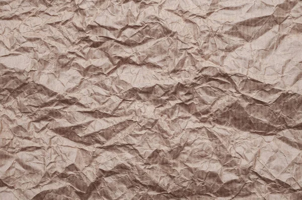 Crumpled kraft paper. Texture crumpled recycled old brown paper.