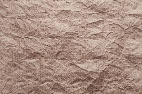 Zerknülltes Kraftpapier. Textur zerknittert Recyclingpapier braun. — Stockfoto