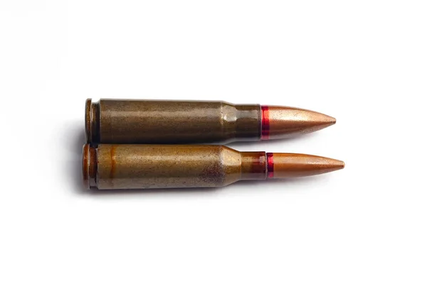 Two old bullets for automatic rifles of 5.45 and 7.62 caliber. Selective focus. — Stock Photo, Image