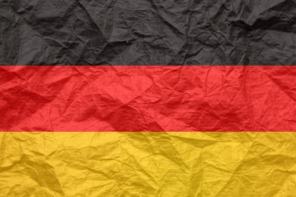 Bandera de Alemania sobre papel viejo y arrugado . — Foto de Stock