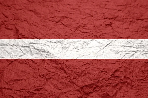 Lettonia bandiera su carta vecchio mestiere stropicciato . — Foto Stock