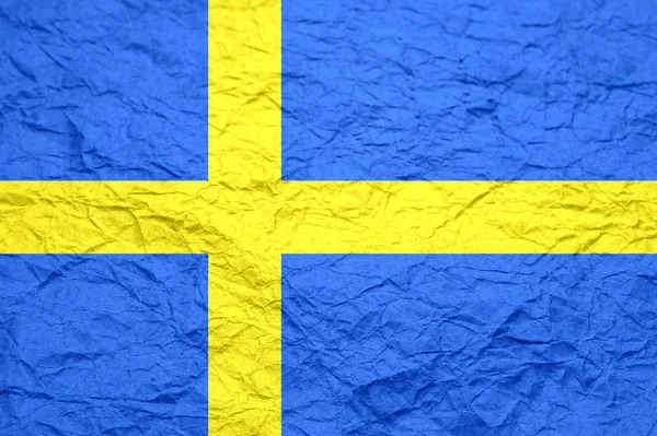 Sweden flag on old crumpled craft paper.