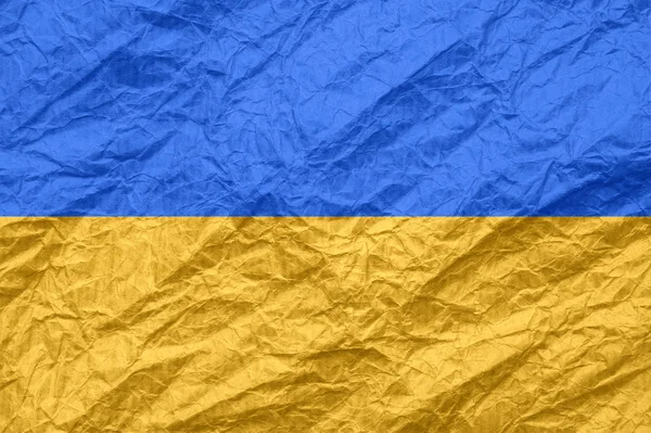 Ukrajinská vlajka na starých pomačkaném papíru. — Stock fotografie