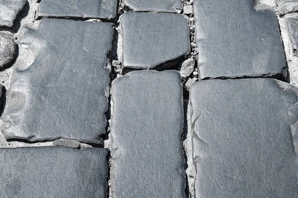 Stone road lined with stone blocks street. The texture of masonry stone. — Stock Photo, Image