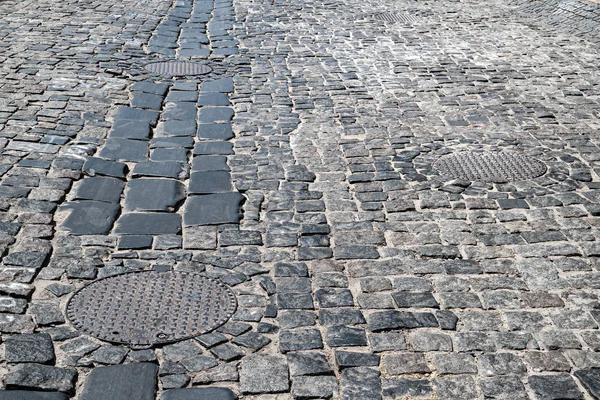 Taş bloklar sokak ile kaplı taş yol. Yığma taş dokusu. — Stok fotoğraf