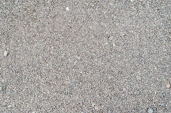 Gravel texture. Fine light gray stone gravel.