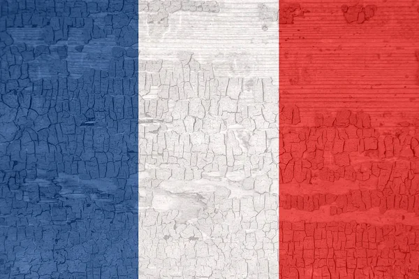 France flag on an old painted tattered wooden surface. — Stock Photo, Image