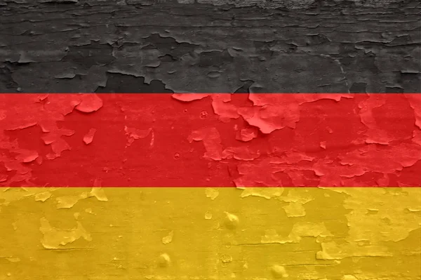 Bandera de Alemania sobre superficie de madera pelada vieja . — Foto de Stock