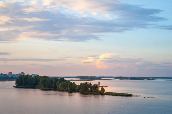 Clouds in the sky above the river. Landscape image of the sky and clouds at sunset in the evening.