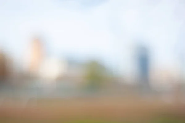 Blurred city background with bokeh effect. Blurry soft image of the cityscape.