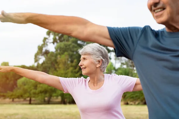 Senior Woman Stretching Arms Park Her Husband Happy Aged Couple — Stock Photo, Image