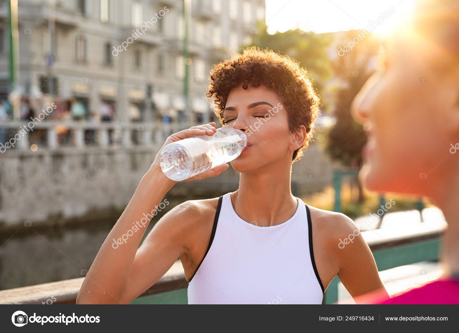 https://st4.depositphotos.com/1743476/24971/i/1600/depositphotos_249716434-stock-photo-athletic-woman-drinking-water-after.jpg