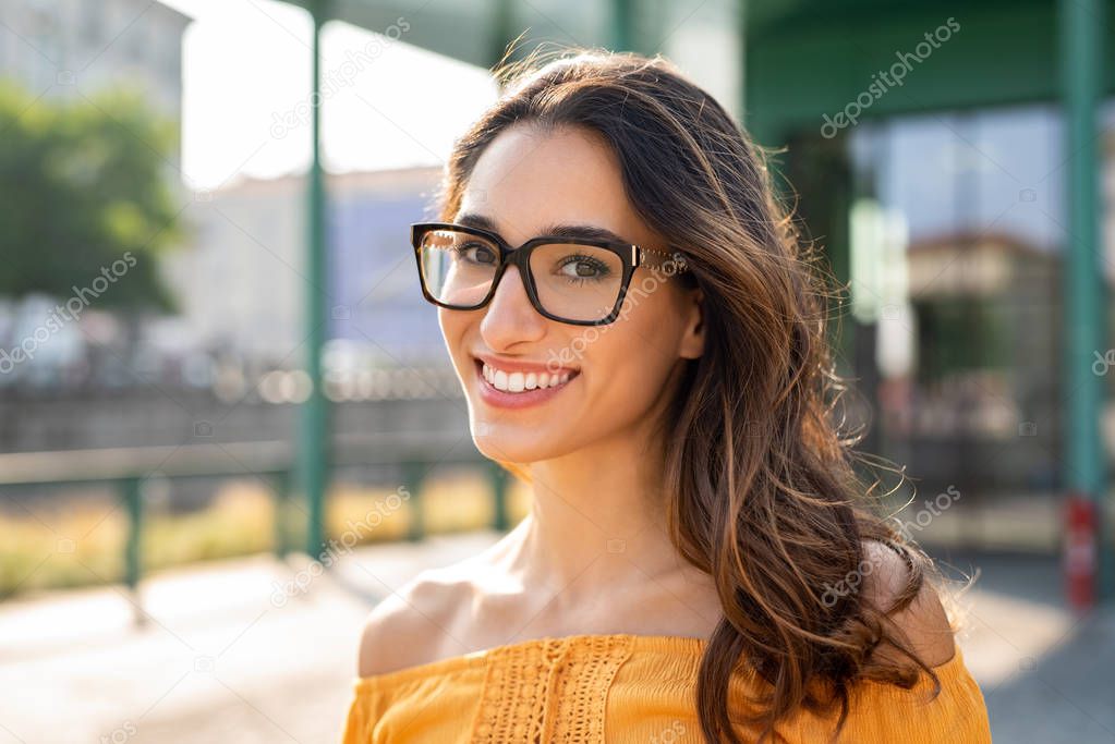 Smiling woman wearing eyeglasses outdoor