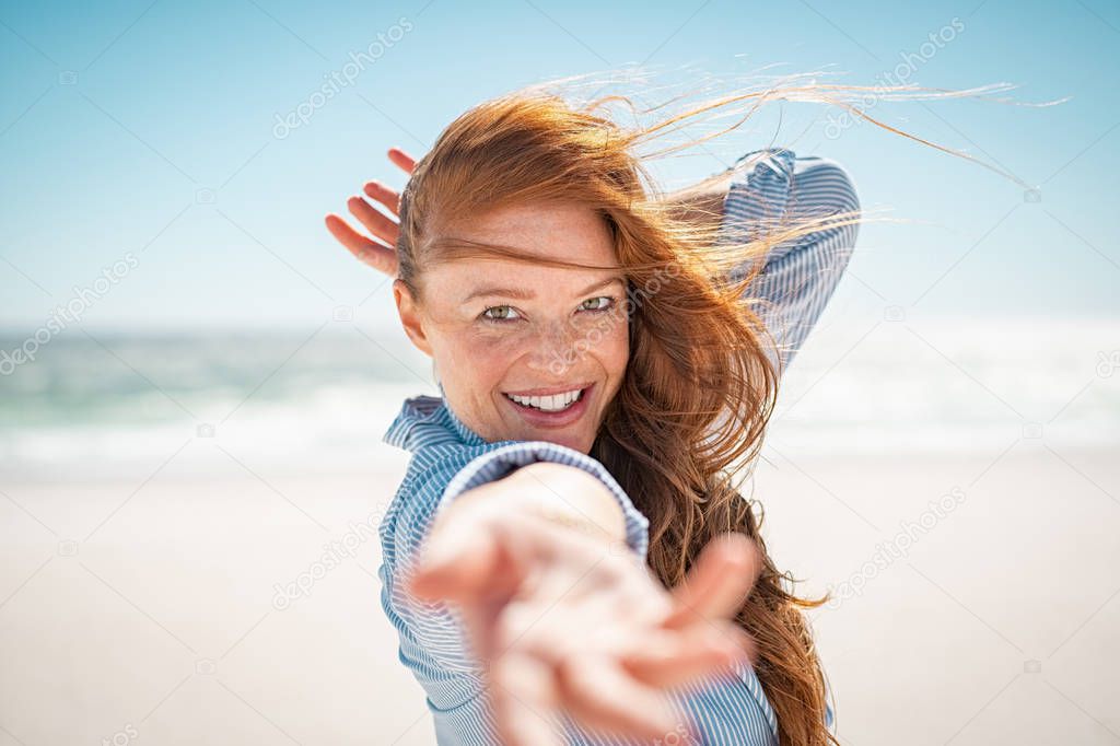 Smiling woman enjoying summer at beach