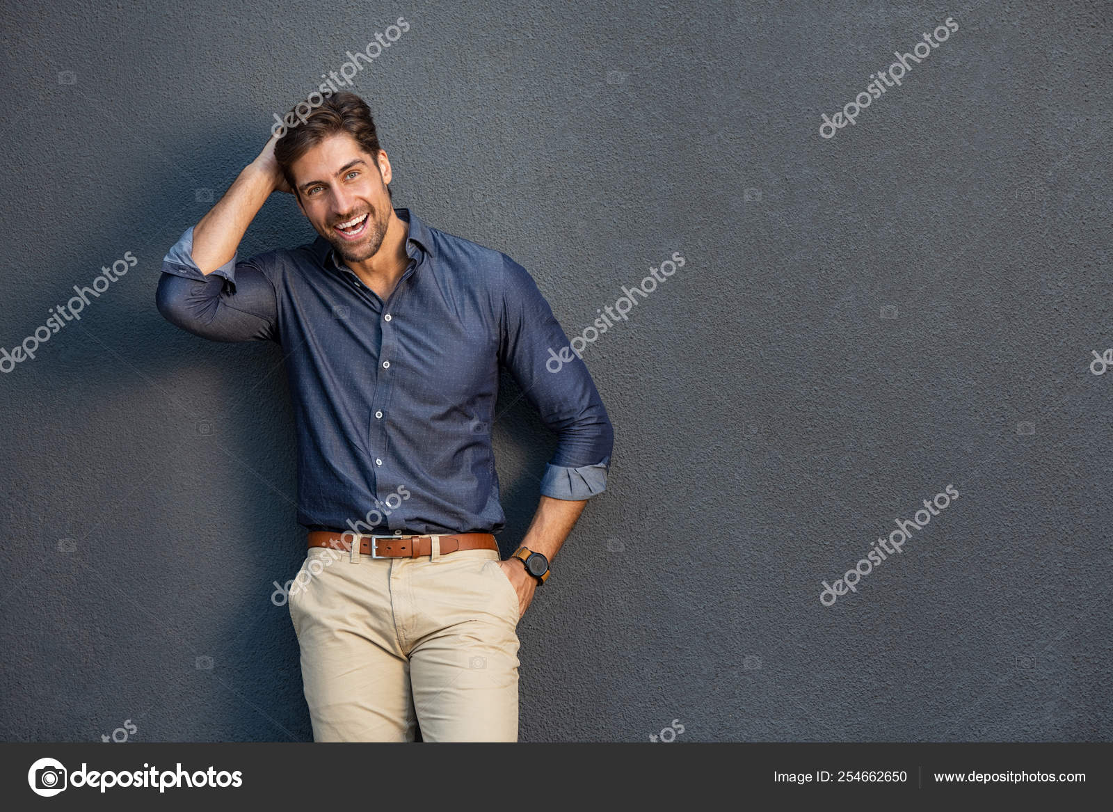 Cheerful young man laughing Stock Photo by ©ridofranz 254662650