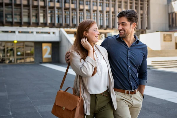 Mature couple in love walking at city centre — Stock Photo, Image