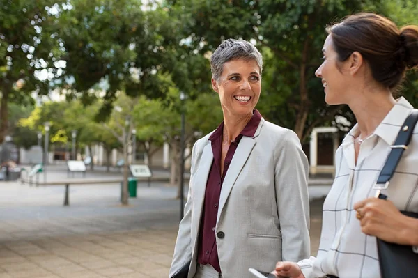 Happy smiling business people talking outdoors — Stock Photo, Image